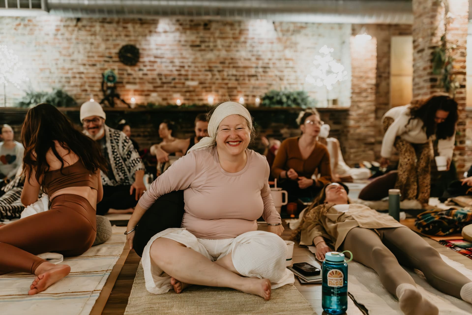 Participant smiling during practice in the brick studio