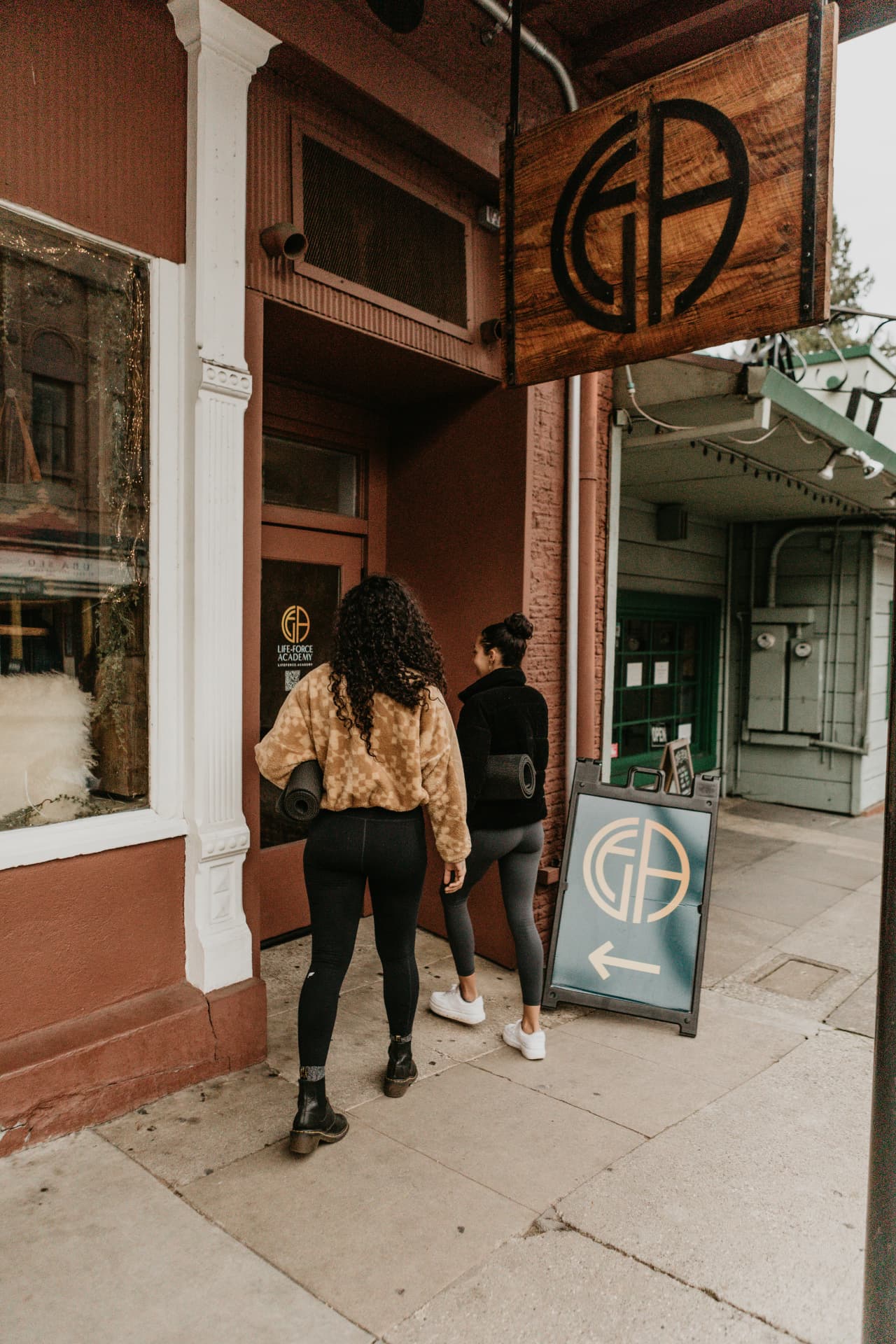 Two people walking into the Life-Force Academy studio in historic Nevada City